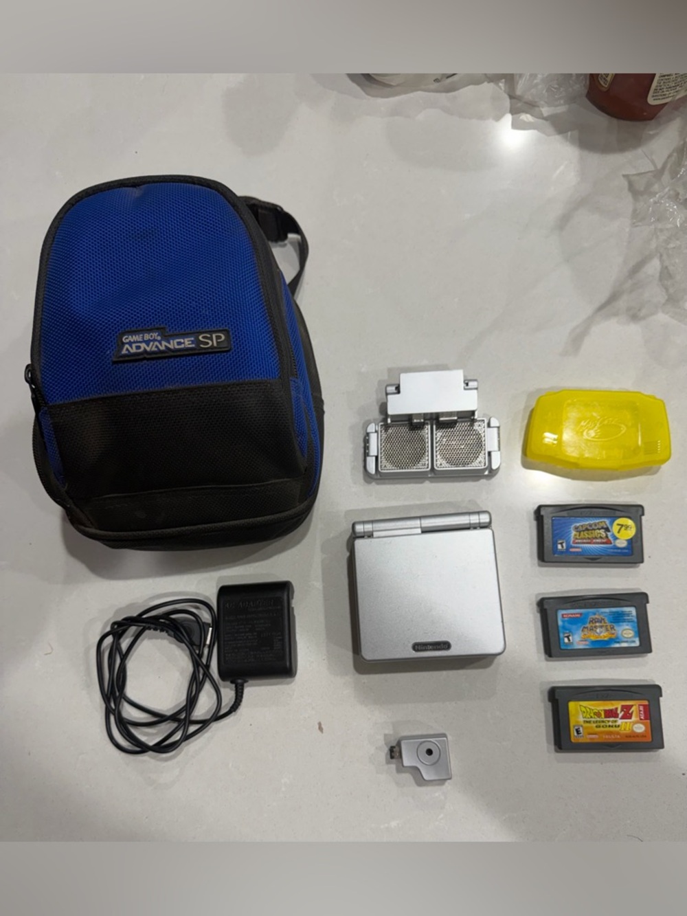 Nintendo Silver Game Boy Advance SP with Blue and Black Carry Case & Accessories